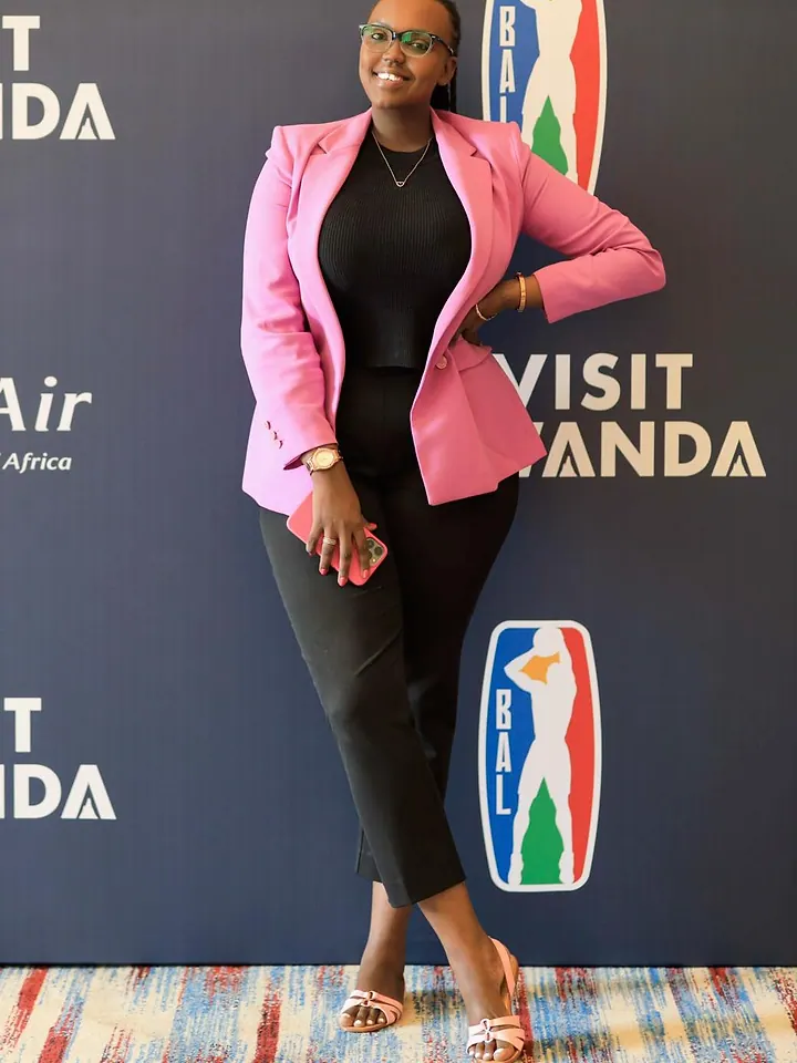 Laetitia in front of Visit Rwanda branding